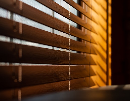 Comparing Quality and Price Faux Wood vs Real Wood Window Treatments